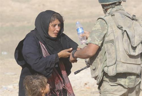 Around 15,000 Syrians cross into Turkey within two weeks